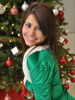 Adorable cutie pie in Christmas outfit undresses to flaunt her sexy legal teen curves