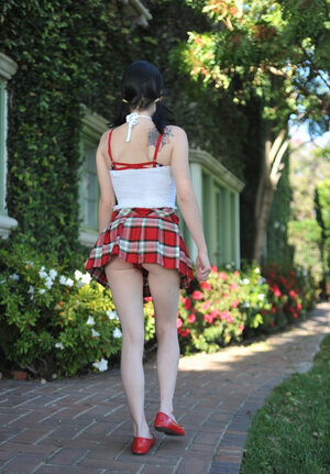 Playful schoolgirl with twin tales isn’t shy to drop her uniform and also pose nude