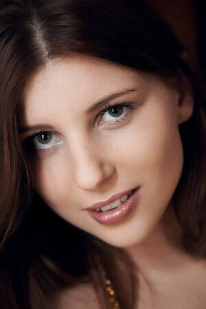 Winsome teen brunette willingly shows off her fantastic big tits in the house