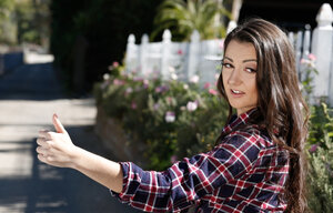 Immature brunette in denim shorts flashes her petite tits while hitchhiking