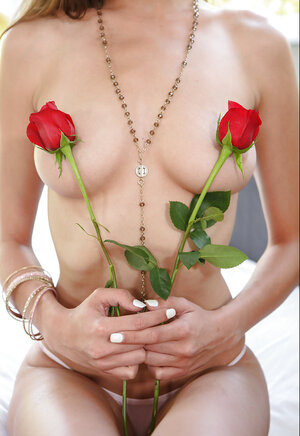 Babe sits in the Lotus and also then strips hiding her erogenous sections with roses