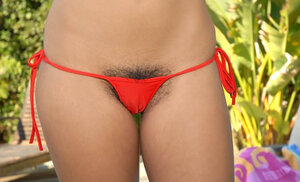 Flaunting her first-class body in a bikini trying to get him hard