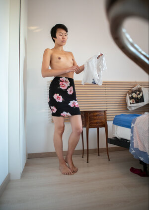 Short hair chick is showing her small tits and long legs