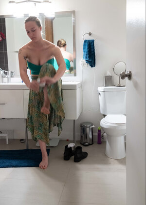 Blonde in a thong shows her backside while transforming quickly