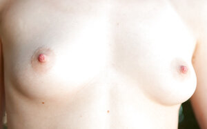 Brunette with natural tits is going to showcase them outside