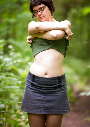 Underweight brunette is going to finger herself while outside