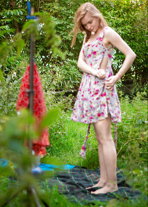 Slender gal decides to strip outside to show off her body