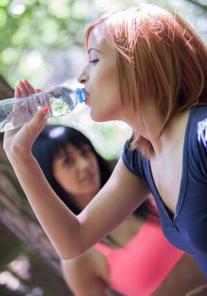 Hand besidessome aroused cutie pies Karin Key and besides Ria Sun banging outside