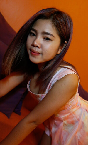 Sexy Asiatic teen strips her dress down to flaunt her hairy cunt