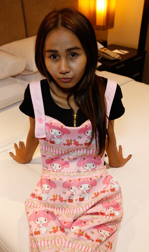 Edgy Thai gal named Puy is going to smoke and moreover tease in overalls