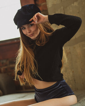 Nice-looking teen's 1st time posing with not a thing but black stockings on