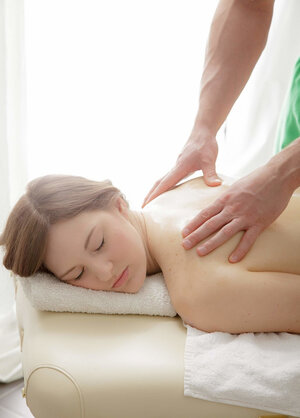 Blonde kisses purple pole before fucking on the massage table