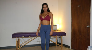 Cute brunette masseuse offers an arousing handjob while topless