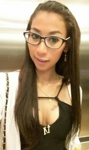 Asiatic brunette with sexy tattoos snapping multiple hot pix