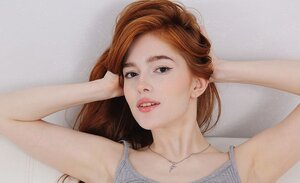Breathtaking ginger Jia Lissa sheds panties and plays with her trimmed pussy
