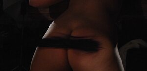 Dominant dude lights a cand additionallyle and additionally pours girl's slender body with hot wax