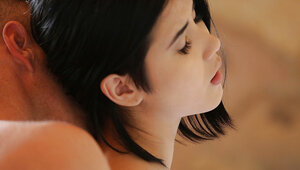 Fantastic twosome between brunette girl and lad on white sheets in action