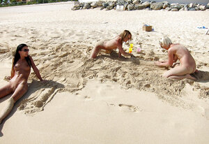 Group of immature sinful girls pose absolutely naked on the beach with no shame