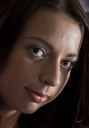 Leggy teeny with tiny tits gives close-up of her pink bald vagina in the studio