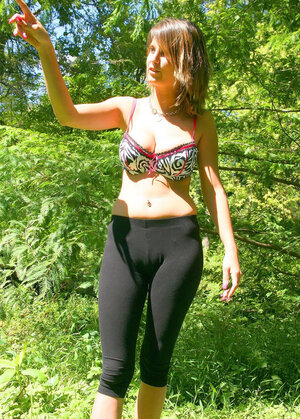 Slender hussy with sexy piercing shows her gigantic tits on a sunny day outdoors