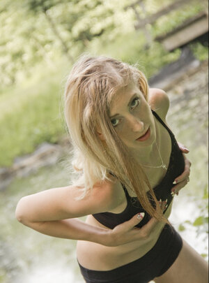 After smoking a cigarette slim babe spontaneously unclothes in the fresh air