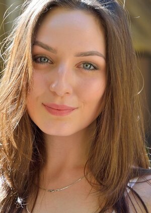 Legal teen in red skirt and black high heels walks naked in the hotel courtyard