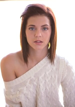 Thoughtful teenage Kiera Winters takes off white sweaters and panties on the balcony