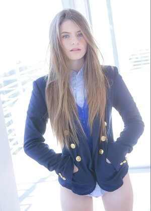 Seducing schoolgirl with sexy long hair Alice March flaunts her good-looking body