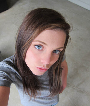 Nice-looking young lassie with small tits loves jacking off her smooth cunny