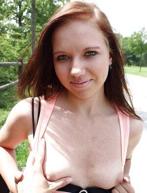 Non-pro redhead girl agrees to show her bra buddies on camera in the public place