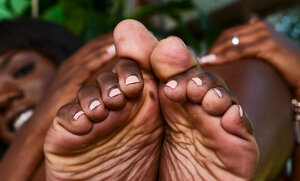 Black babe has fine white feet that guys would like to cover with cum