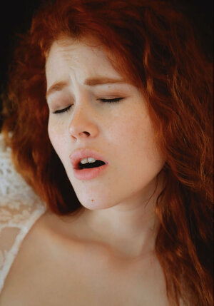 Precious redhead in lace white gown plays with her sweet pink pussy and moans