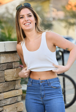 Performer in blue jeans and jacket loves flashing her petite boobs on camera