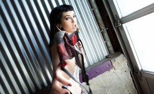 Tattooed brunette with hoop earrings shows how her smooth pink slit looks like