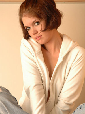 There is a pole and plus the nude broad with red hair imagines herself as a stripper